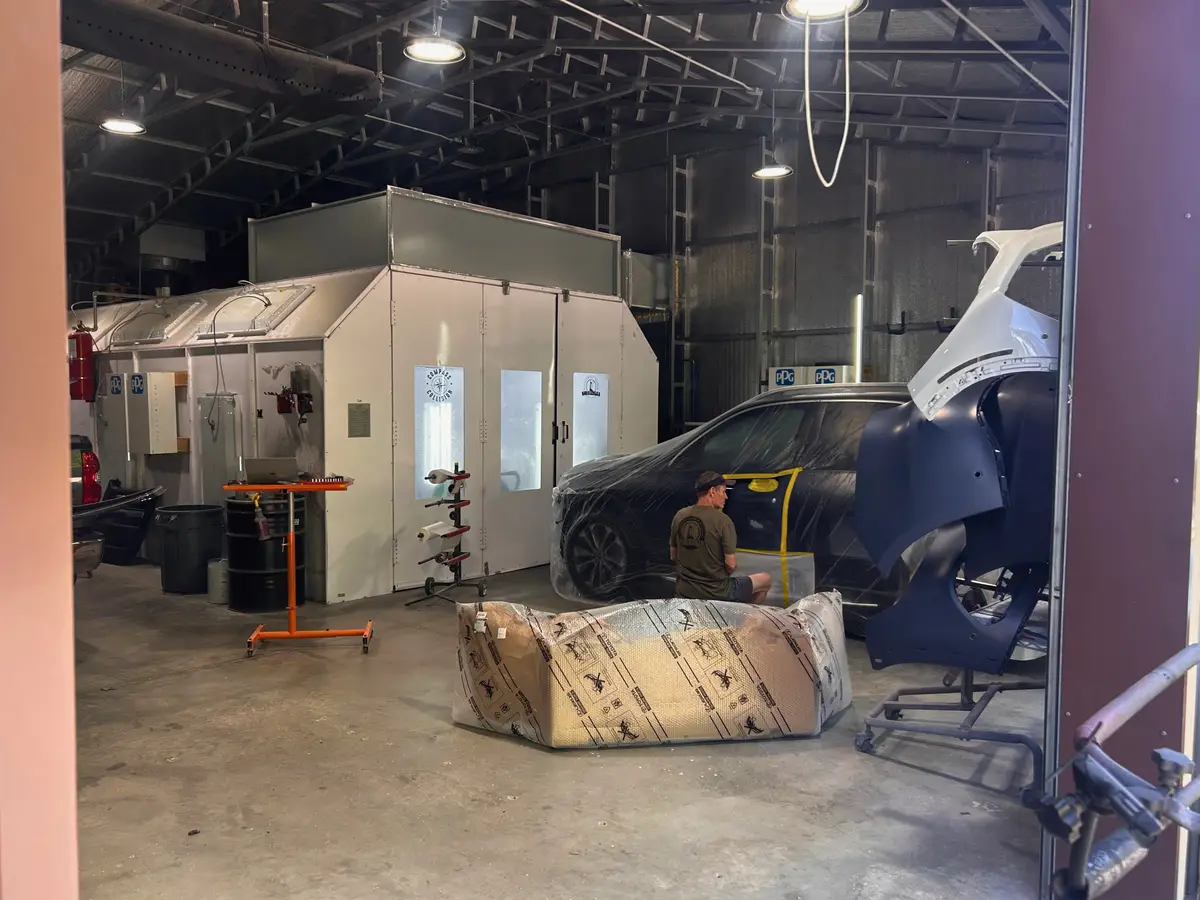 Compass Collision paint booth with technician Charleston SC